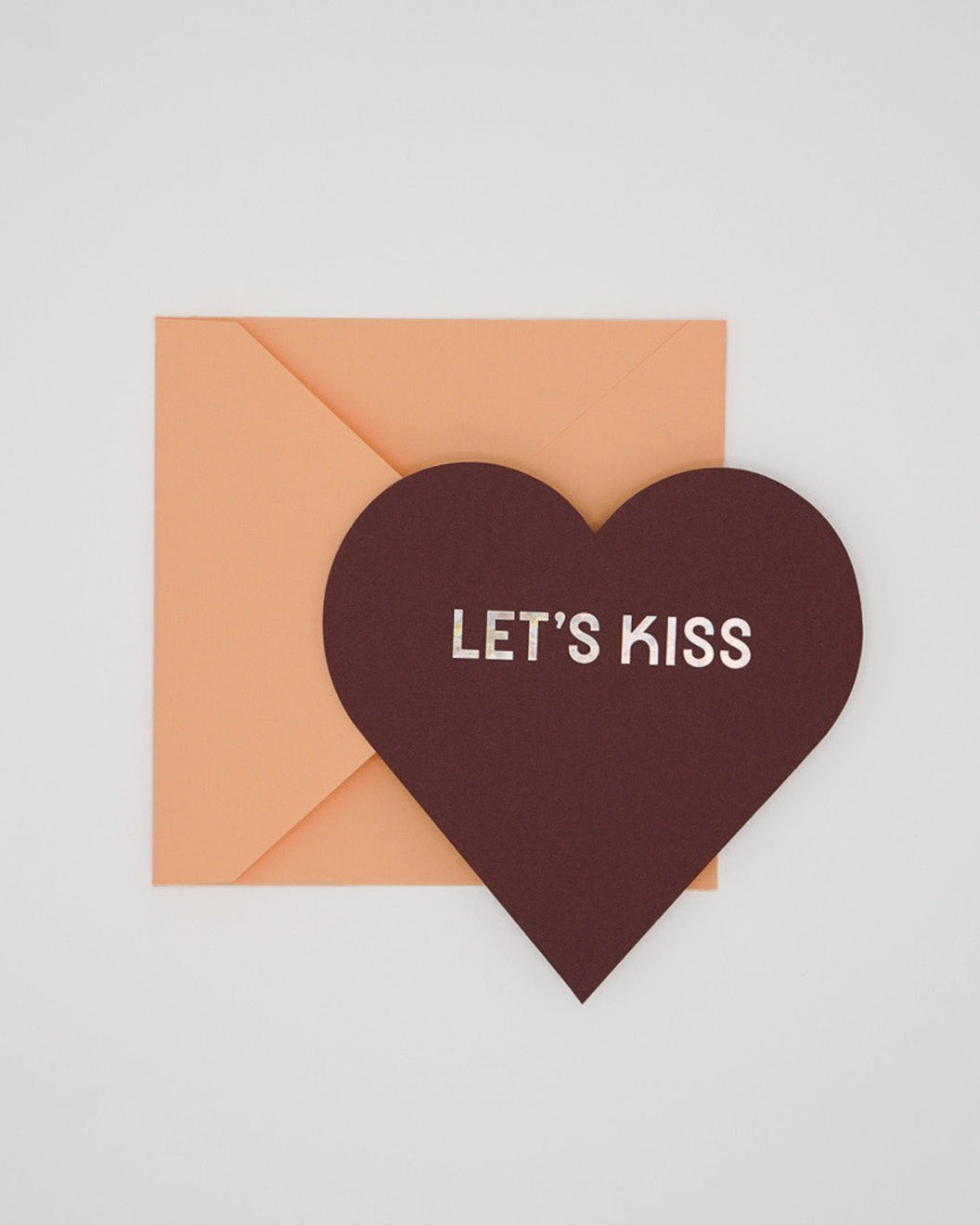 Letterpress Red Valentine card in the shape of a heart with Be Mine foiled and orange envelope