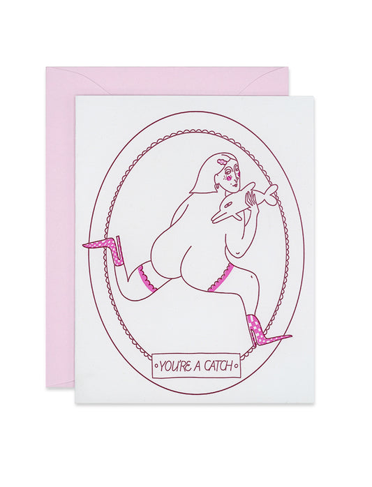 Letterpress Valentine's day greeting card with a naked woman running away in high heels, holding a small dolphin. There is a frame surrounding her that says, "You're a Catch."