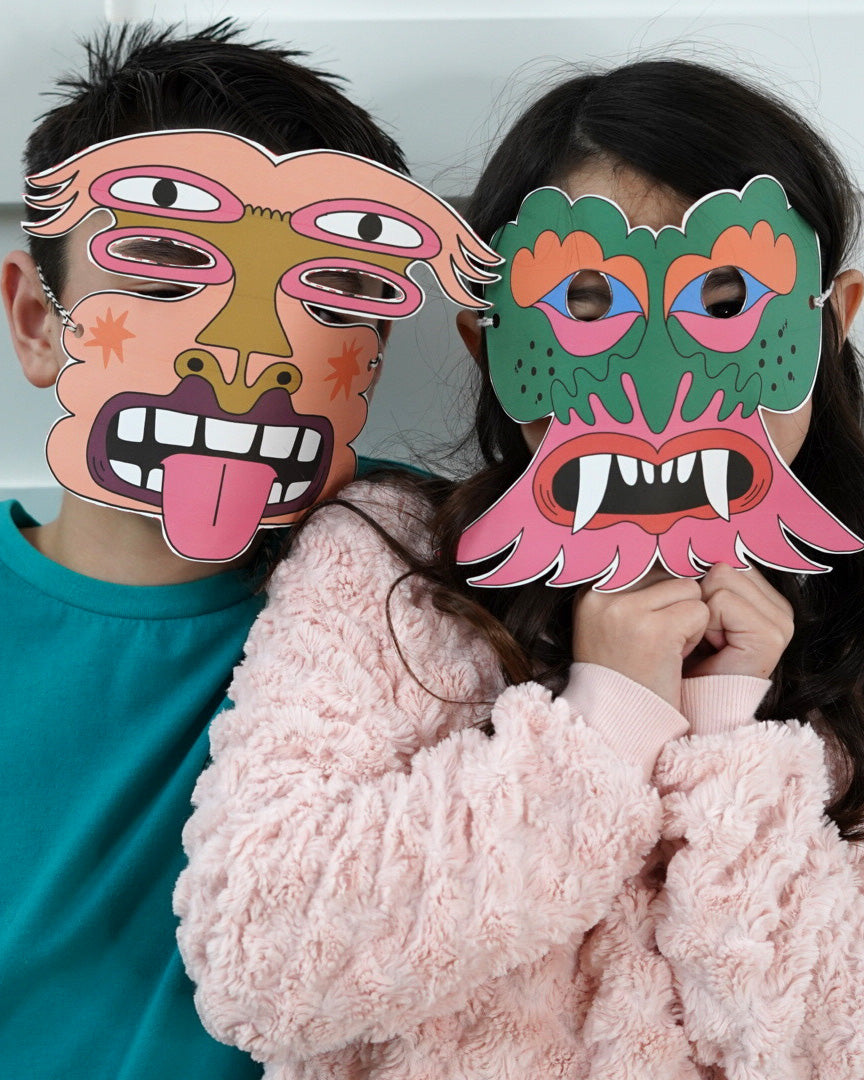 Two children wearing the kid's printable valentine masks