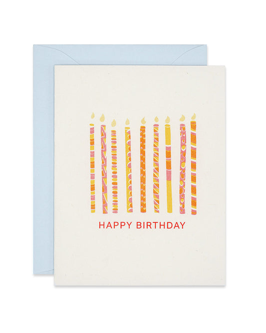 Riso birthday card with orange and yellow patterned candles, link