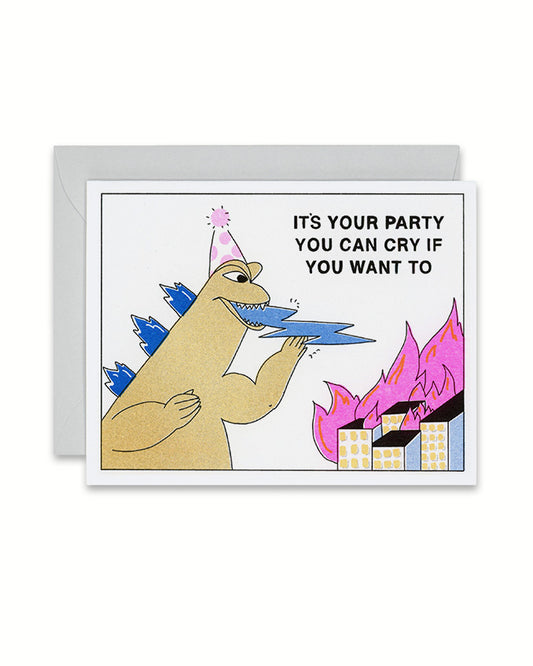 Riso kid's birthday card with godzilla breathing lightning next to buildings on fire, it's your party you can cry if you want to, link